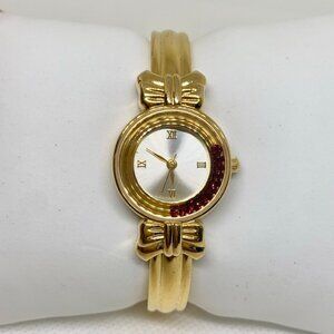 Avon Watch Women 22mm Gold Tone red Floating Crystals quartz size 6.5” running